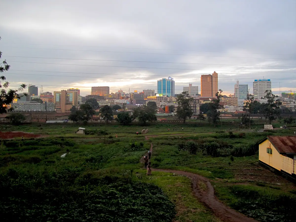 The skyline of Kampala with office towers seen over green hills