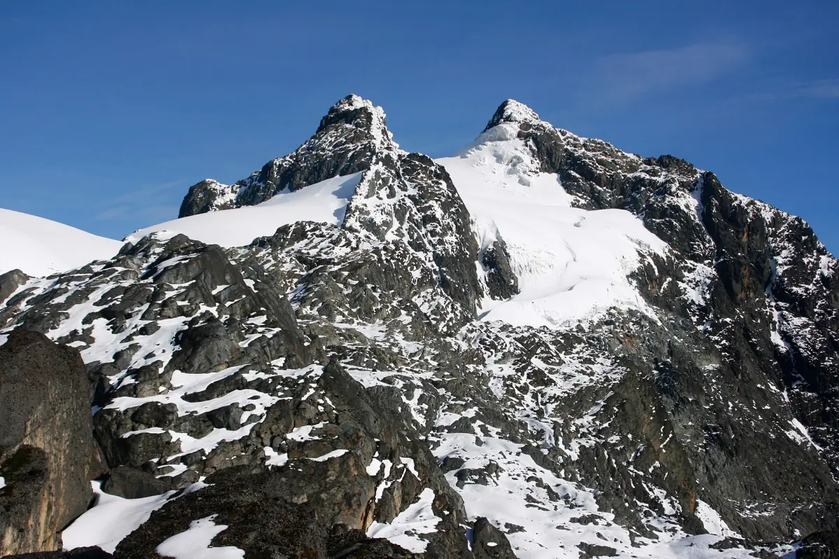 Margherita Peak with snow and rock under a blue sky